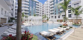 Heated zero-edge saltwater pool with sundeck, cabanas, fire pits and water feature